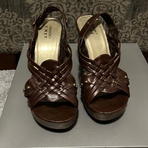 Emergency Exit: size 7 casual heels. In a rich brown color. Buckle heel strap.
